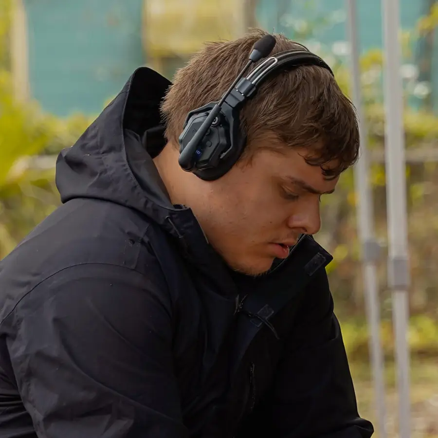 Matthew Nelson on set wearing a comms headset